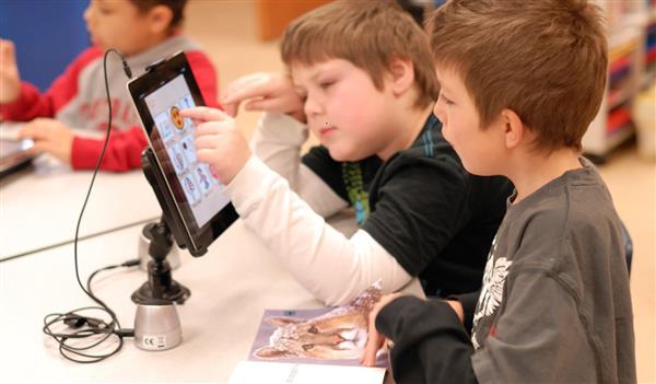 boys reading together 